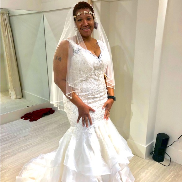 Never Worn Wedding Gown.